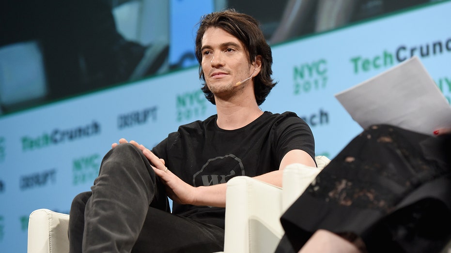 Adam Neumann speaks at an event