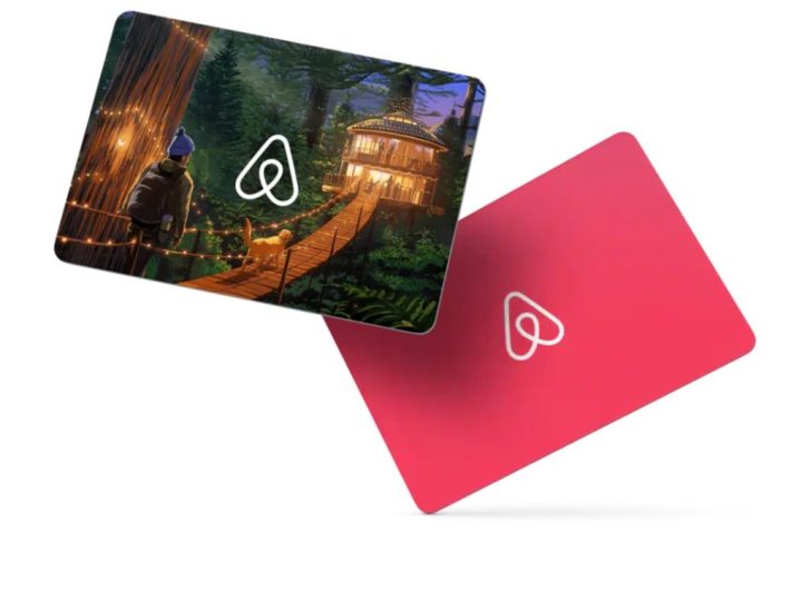 AirBnB gift cards, side by side. one depicting a hiker visiting a nice treehouse and the other is just a generic pink card.