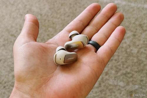 Bose QuietComfort Ultra Earbuds in a hand