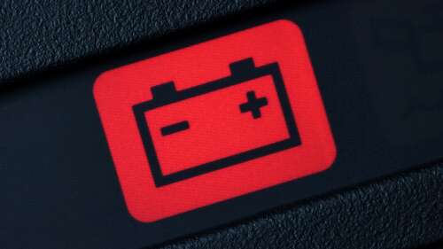 Battery warning light on car dashboard. 