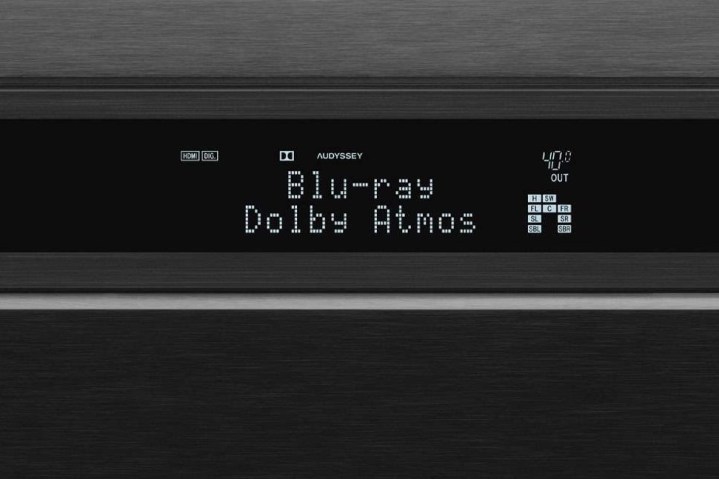 Close-up of an A/V receiver display showing Dolby Atmos.