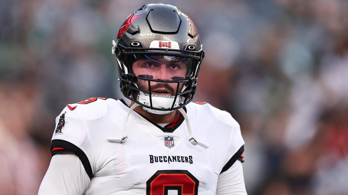 Tampa Bay Buccaneers quarterback Baker Mayfield looking towards the camera, wearing an American football helmet.