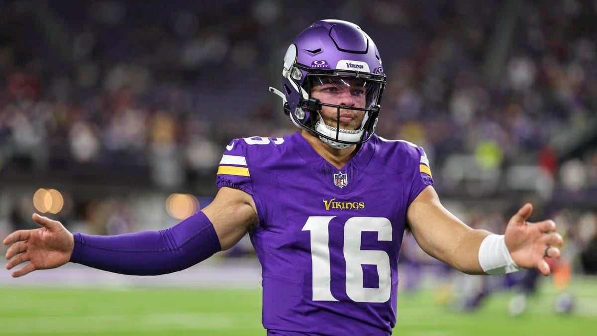 Jaren Hall of the Minnesota Vikings holding arms outstretched.