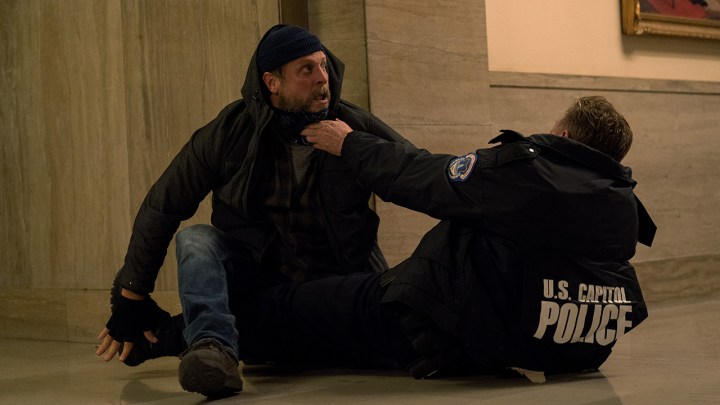 Hal attacking an officer at the Capitol riot in a scene from The Morning Show.