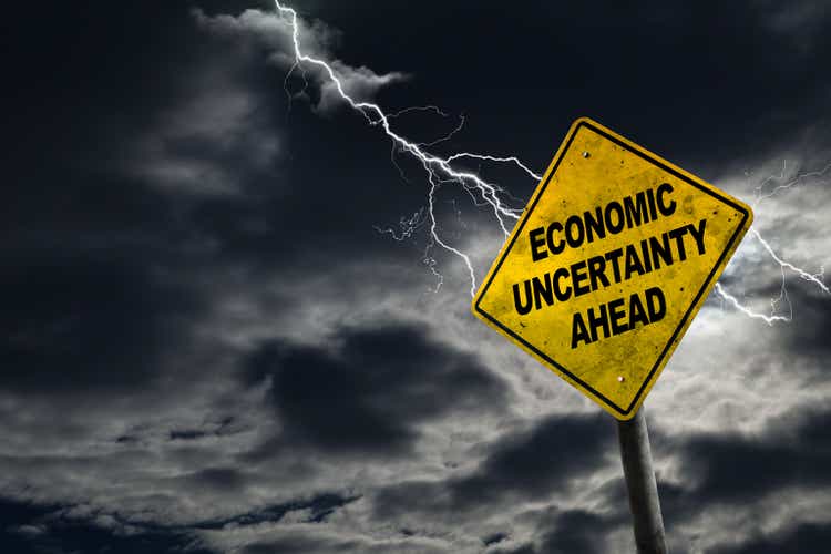 Economic Uncertainty Ahead Sign With Stormy Background