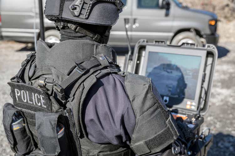 Police Swat Officer Using a Mechanical Arm Bomb Disposal Robot Unit