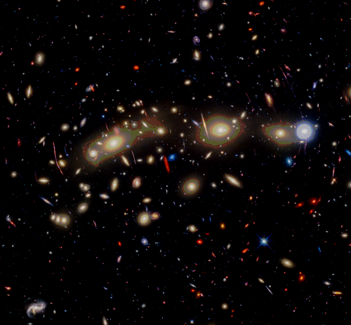 At center is an expansive collection of galaxies in the galaxy cluster MACS0416.