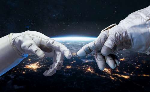 Astronauts gloves connecting in space