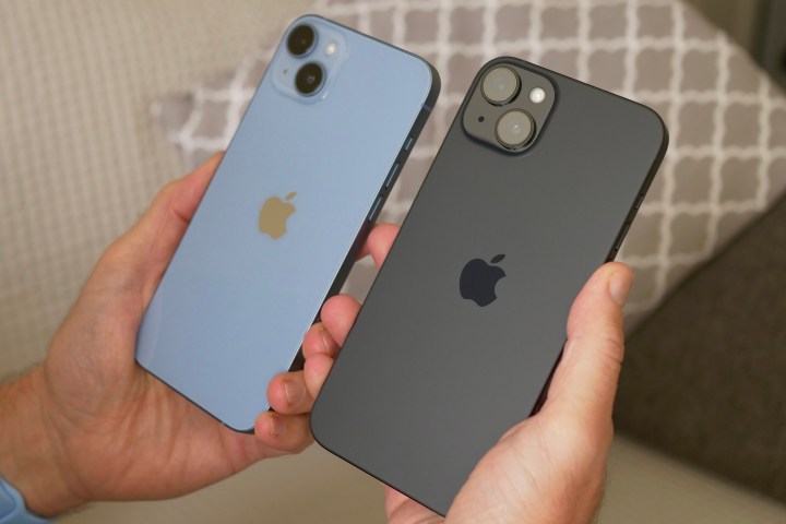 A person holding the Apple iPhone 15 Plus and iPhone 14 Plus