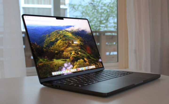 An open MacBook Pro on a table.