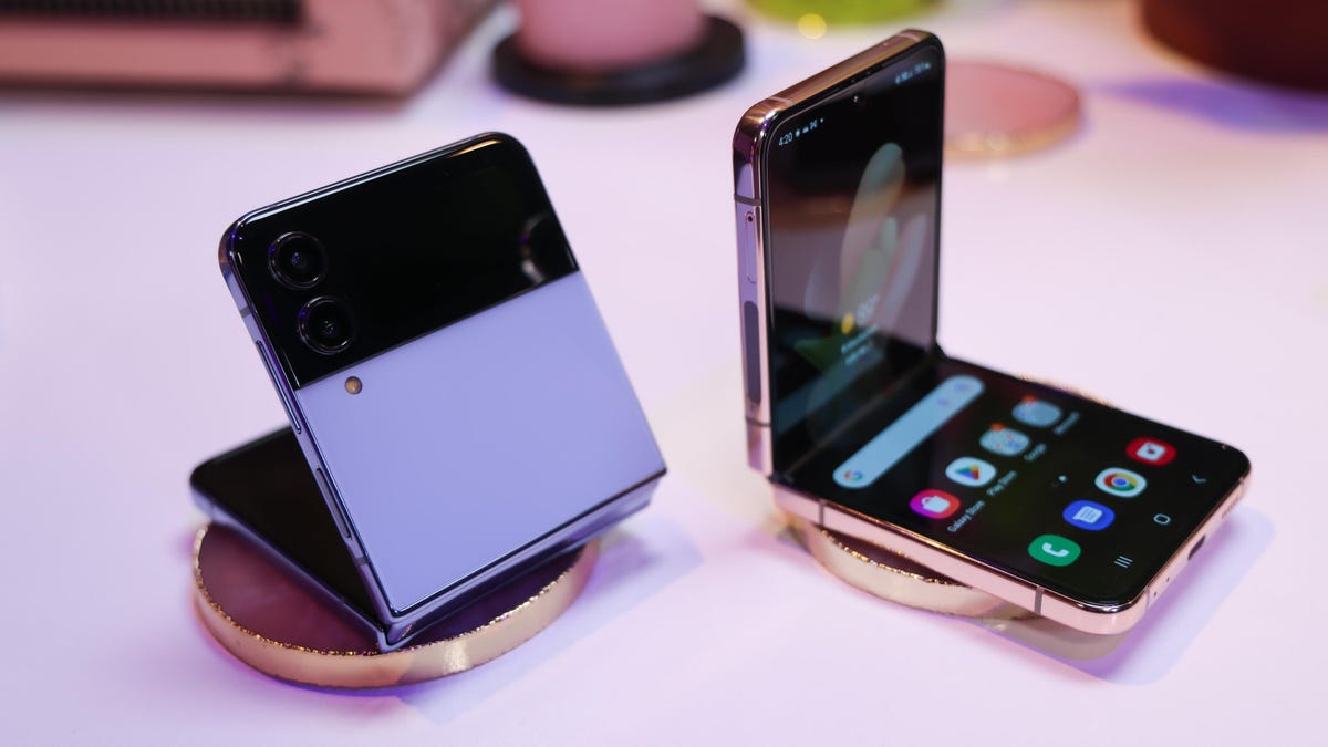 Two Samsung Z Flip 4 phones on a display table. 