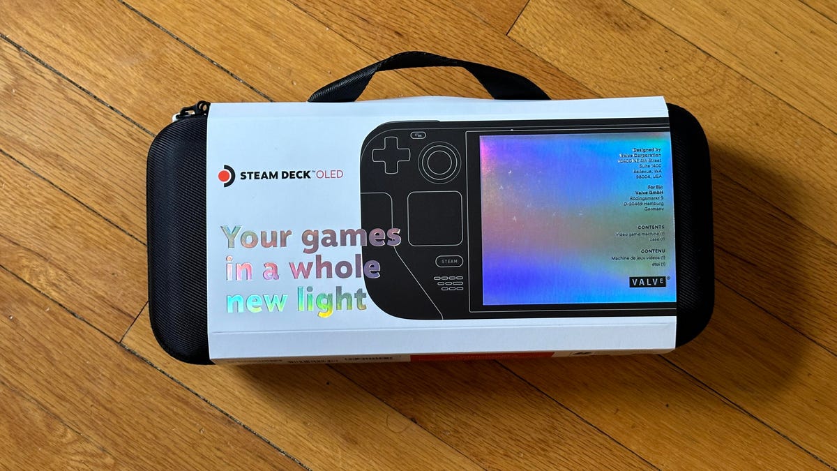 Steam Deck game handheld in its packaging on wood floor