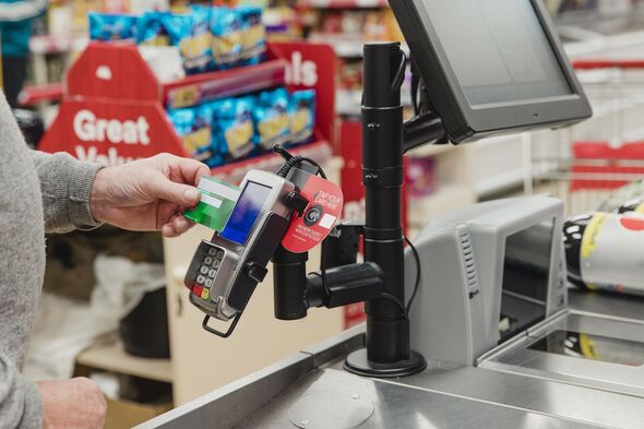 Senior man using contactless payment