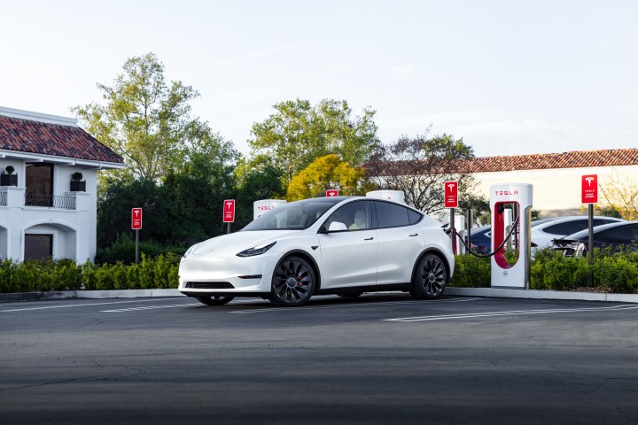 White Tesla at a Supercharger