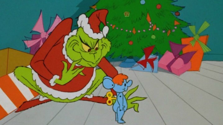 The Grinch with a toy mouse in Dr. Seuss' How the Grinch Stole Christmas.