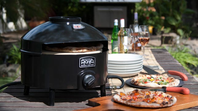 oven on table with pizza