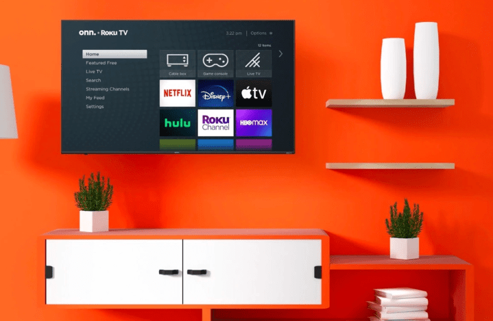 The onn. 70-inch 4K Roku TV hangs on the wall as part of a home theater arrangement.