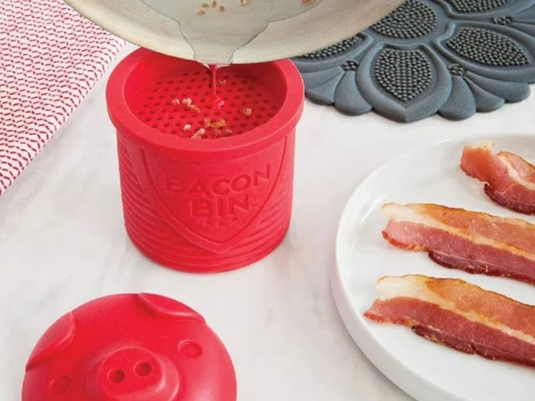 bacon grease being strained into bin