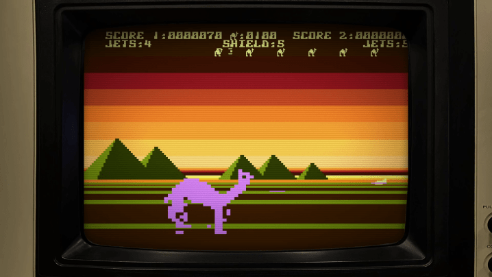 A llama walks in front of pyramids in Llamasoft: A Jeff Minter Story.