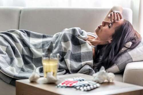 photo of sick woman lying on sofa