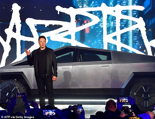 Futuristic: Elon Musk pictured at the event with the new vehicle