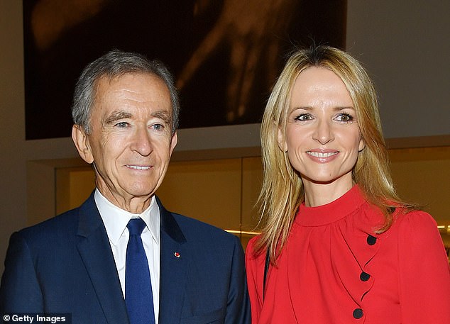 In the red: Founder and chief Bernard Arnault, with daughter Delphine