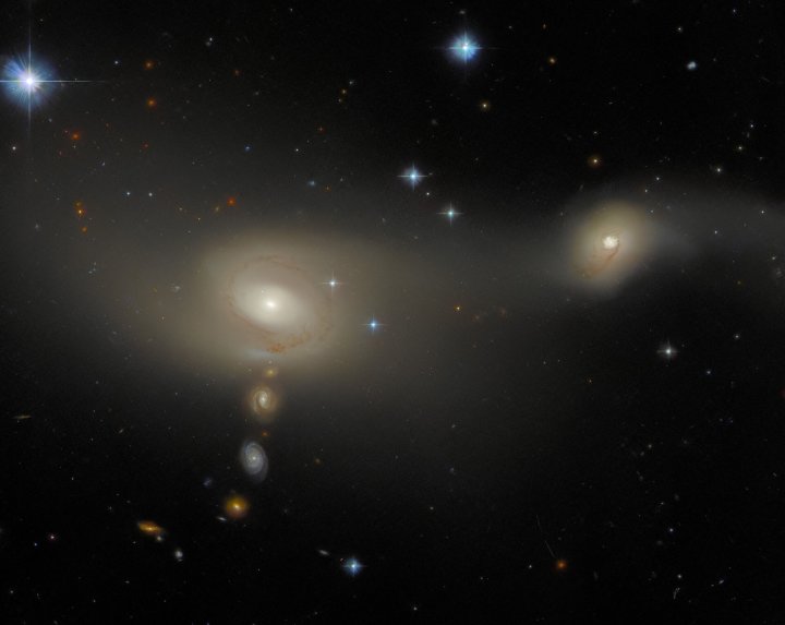 An interacting galaxy system known as Arp-Madore 2105-332, that lies about 200 million light-years from Earth in the constellation Microscopium. 