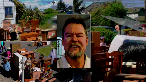 Man in front of squatters belongings