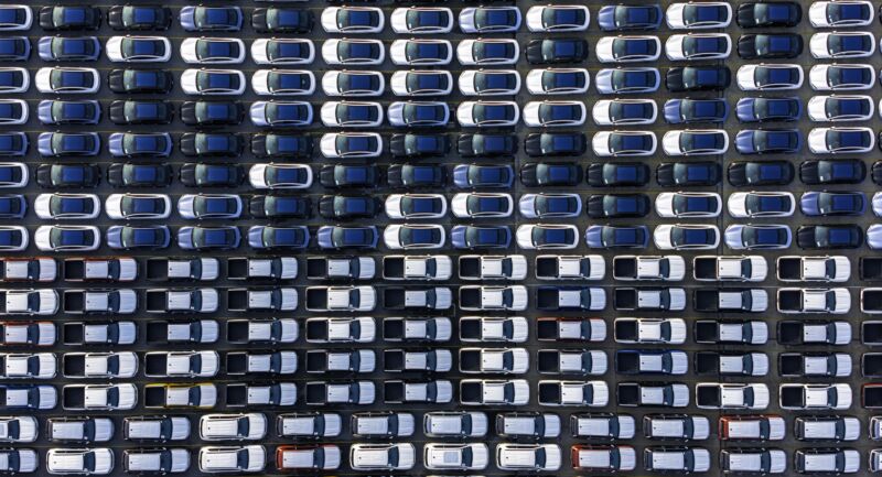 Aerial top view car park at sea port or manufacture waiting for logistics.