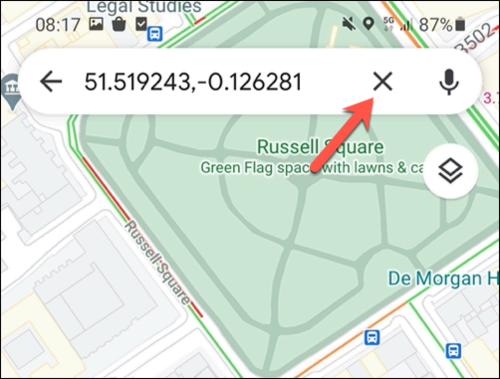 To remove a temporary pin in Google Maps, tap the cross icon on the search bar, or tap elsewhere on the map.