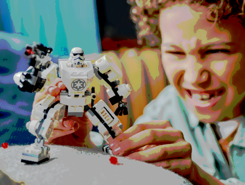 A child playing with the Stormtrooper Lego Set. 