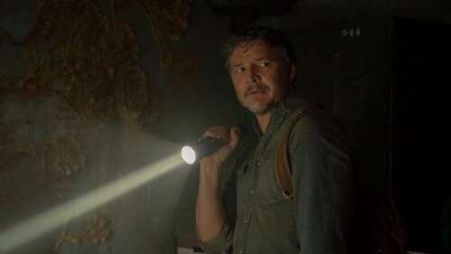 Pedro Pascal shines a flashlight.