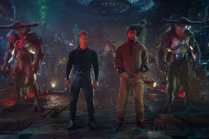 Shark guards flank Orm and Arthur in Aquaman and the Lost Kingdom.