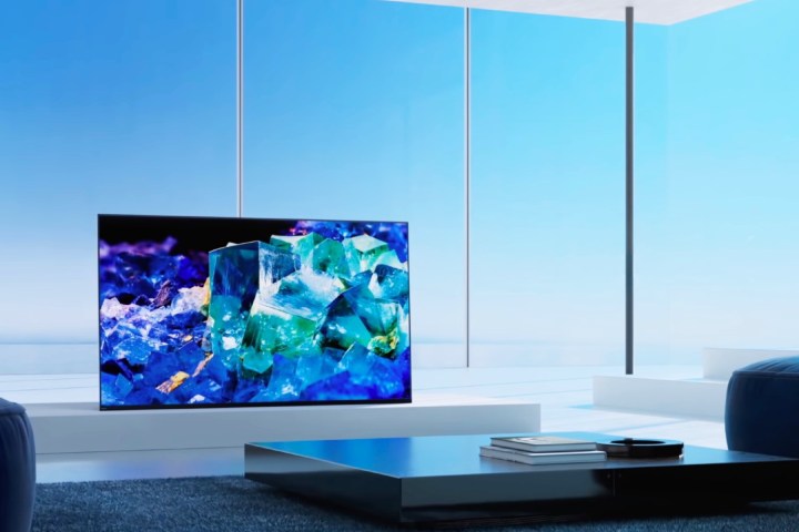 A Sony Bravia A80K 4K TV sits on a table in front of a large window.