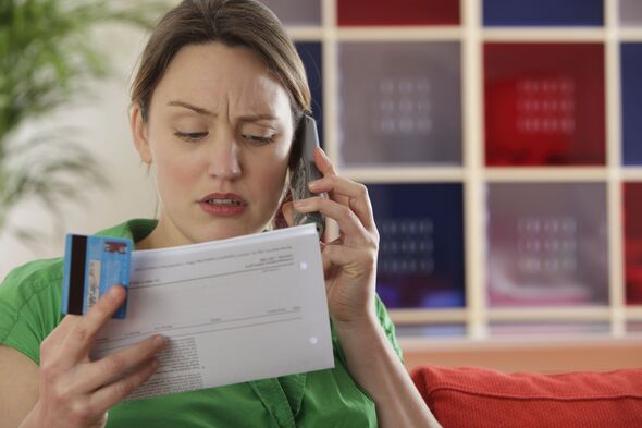 Woman paying bills by phone