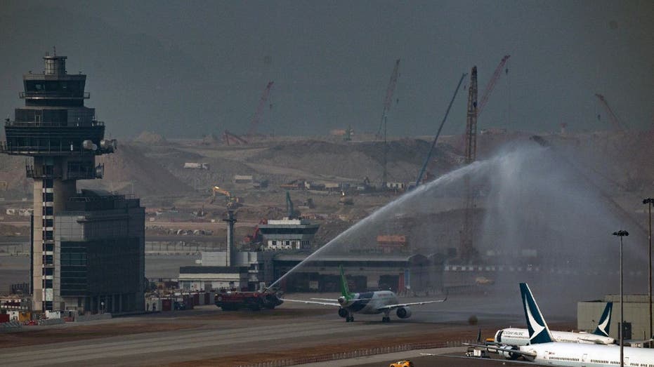 A Chinese made passenger jet recives a water salute in Hong KOng