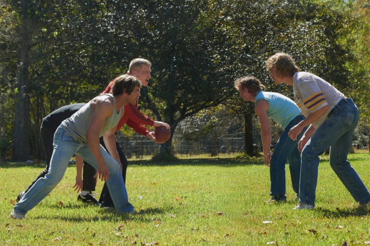 The men of the Von Erich family play football together in The Iron Claw.