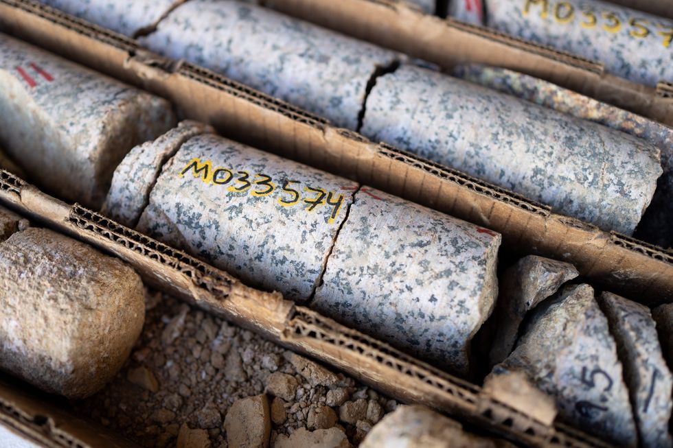 A close-up of core samples, some broken apart into chunks of rock