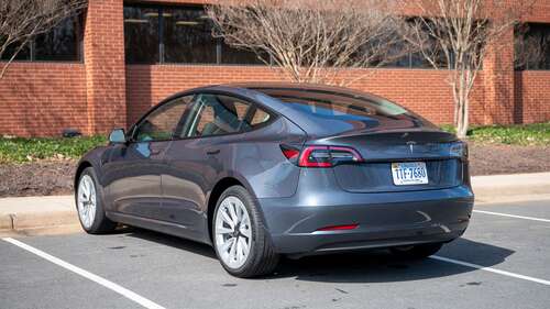 Rear and side profile of the Tesla Model 3.