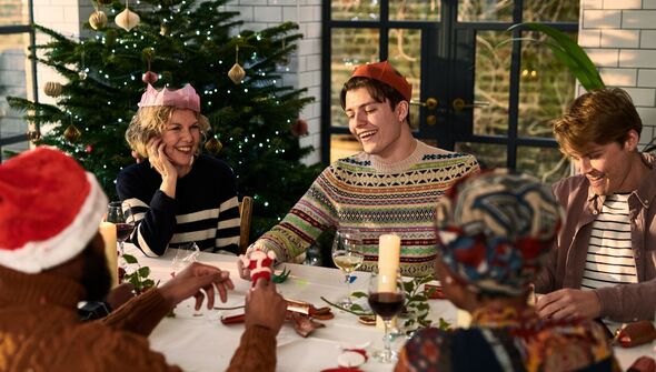 family enjoy Christmas dinner