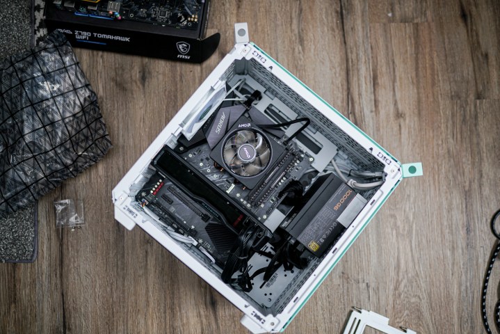 The internals of the Cooler Master Qube 500 PC case.