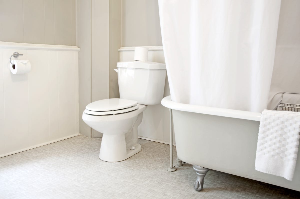 A bathroom interior, all in white