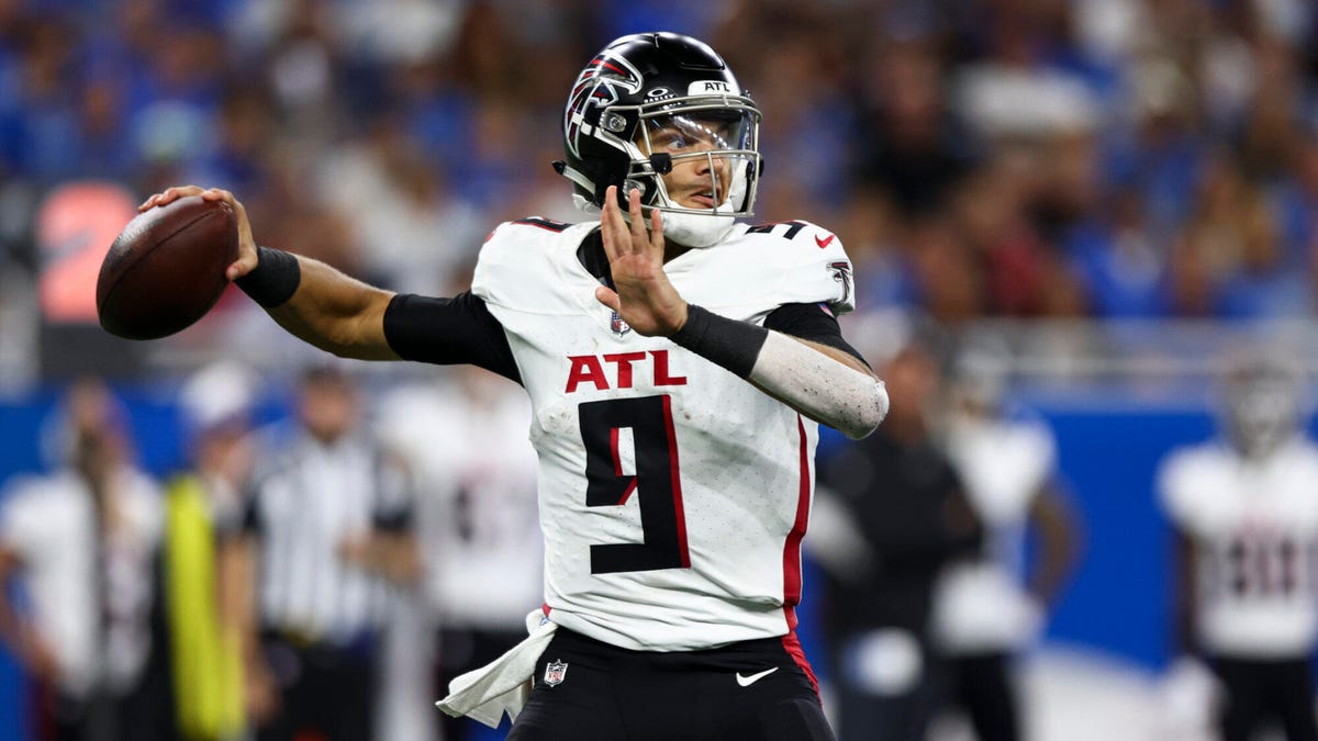 Atlanta Falcons quarterback Desmond Ridder preparing to throw a ball with his right hand.