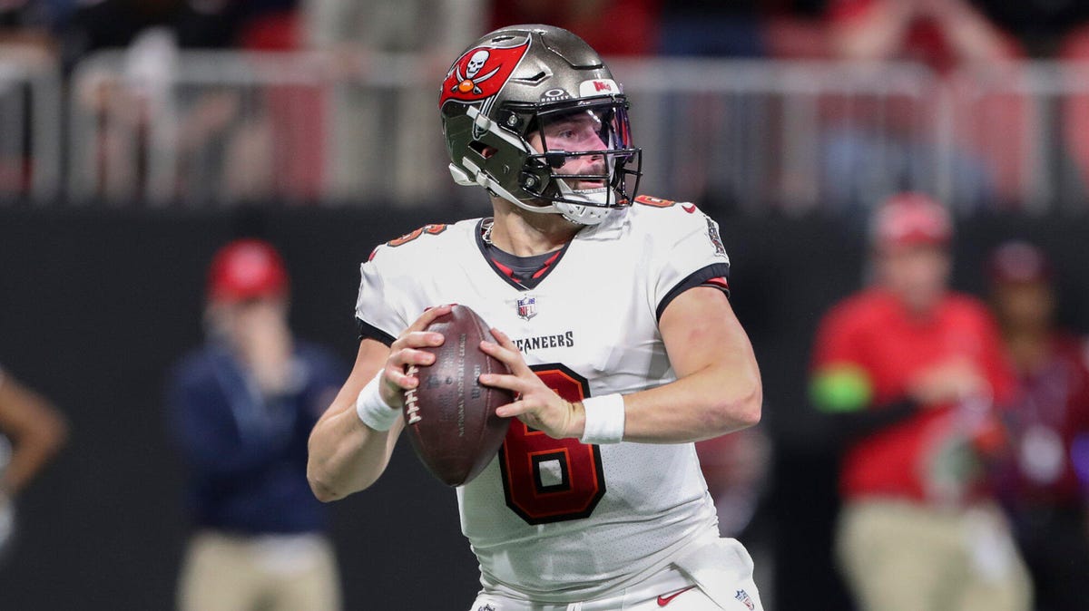 Baker Mayfield of the Tampa Bay Buccaneers with both hands clutching a ball.