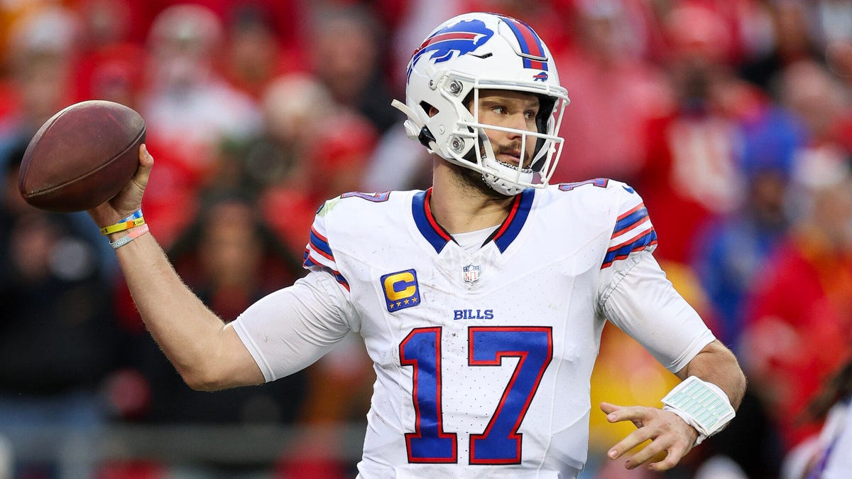 Josh Allen of the Buffalo Bills preparing to throw the ball with his right hand.