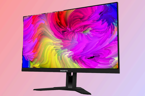 GIGABYTE M28U gaming monitor against a pinkish background