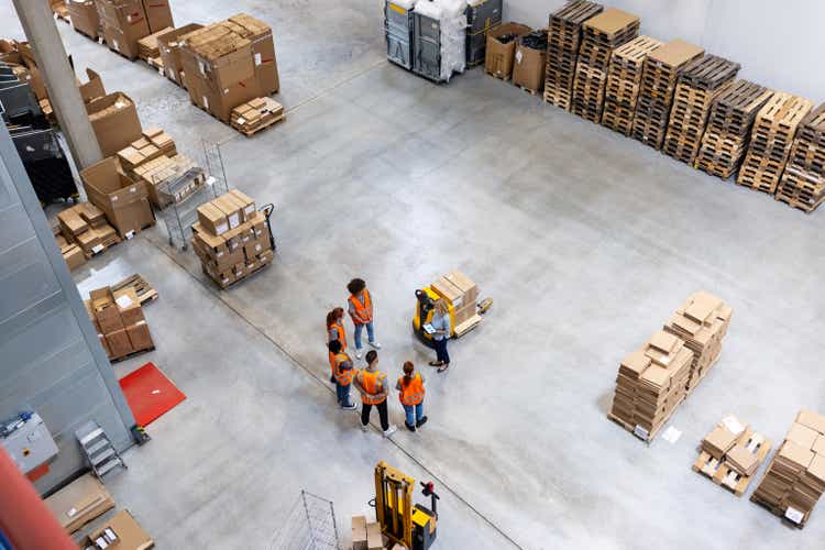 High angle view of warehouse dispatch team meeting