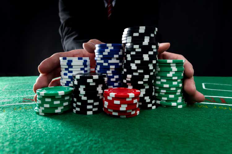 Businessman hands pushing gambling chips