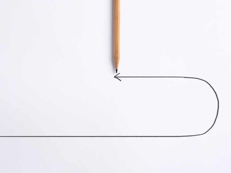 Decision to change direction in business, finance, career or education. Decision to renounce or retract. Pencil draws a turning point arrow line on white background.