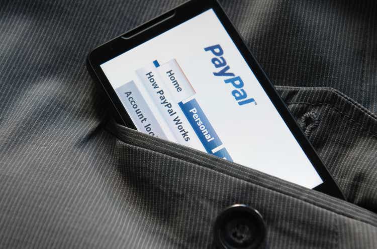 Smart phone with Paypal.com logo in the pocket